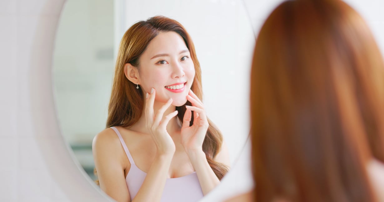 woman is looking in mirror